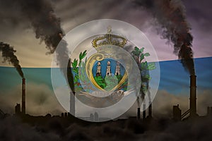 heavy smoke of industrial chimneys on San Marino flag - global warming concept, background with place for your logo - industrial