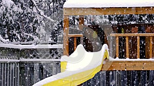 Heavy snow falling on backyard play structure