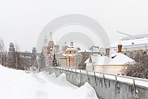 Heavy snowfall in Moscow. Snow-covered roads and Zaryadye Park with a view of the Kremlin and St. Basil`s Cathedral
