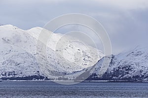 Heavy snows cover the mountains surrounding Loch Leven, Scottish Highlands, UK