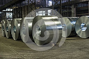 Heavy steel coils on the steel mill floor photo