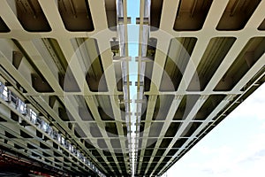 Heavy steel girders of span bridge. underside view.