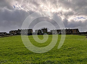 Heavy thunder clouds, hanging over Victorian houses near, Low Lane, Queensbury, UK