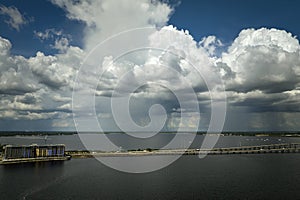 Heavy thunderstorm approaching traffic bridge connecting Punta Gorda and Port Charlotte over Peace River. Bad weather photo