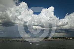 Heavy thunderstorm approaching traffic bridge connecting Punta Gorda and Port Charlotte over Peace River. Bad weather photo