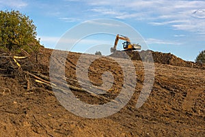 Heavy tracked excavators at a construction site. Special heavy construction equipment for road construction. Soft focus