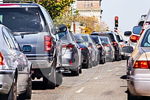 Heavy traffic in downtown San Francisco, California; cars stopped at a traffic light