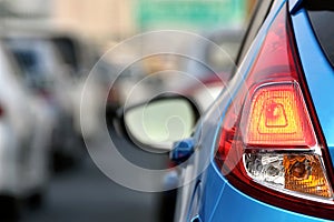 Heavy traffic jams on downtown city highway road, Car tail light close up.