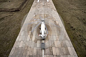 Heavy transport helicopter aerial view. loading equipment on the runway