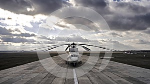 Heavy transport helicopter aerial view. loading equipment on the runway