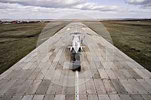 Heavy transport helicopter aerial view. loading equipment on the runway