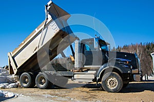 Heavy transport truck parked while waiting for work