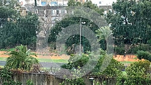 Heavy tropical rain at times turning into hail