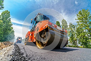 Heavy vibration roller at asphalt pavement works. Road repairing.