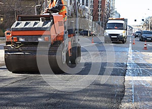 Heavy Vibration roller compactor at asphalt pavement works for road repairing