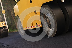 Heavy Vibration roller compactor at asphalt pavement works for road repairing