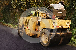 Heavy Vibration roller compactor at asphalt pavement works for road repairing