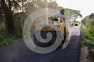 Heavy Vibration roller compactor at asphalt pavement works for road repairing