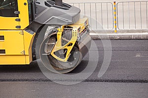 Heavy Vibration roller compactor at asphalt pavement works for road repairing