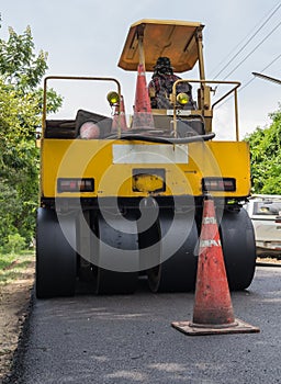 Heavy Vibration roller compactor at asphalt pavement works for road repairing