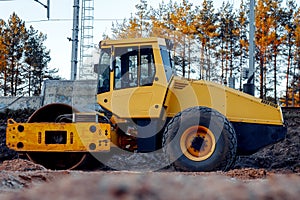 Heavy Vibration roller without a driver on sand road as an example of rest between road works