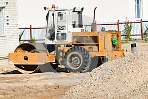 Heavy vibratory roller. road stacker. Orange color