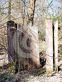 Heavy weathered timber door with rustic nails in a stone door frame