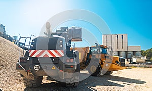 Heavy wheel loader in quarry waiting for work