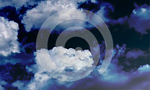 Heavy white clouds over dark blue background