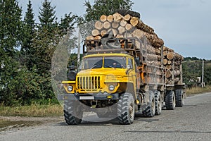 Heavy wood truck,car on blue sky with antenne