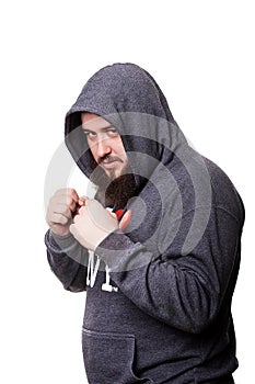 Heavyweight boxer with a big beard in the hood should clenched f
