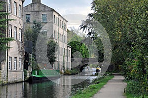 Hebden bridge with the rochdale canal, towpath boats and buildings