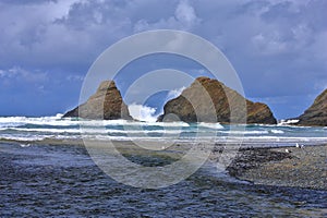 Heceta Head Seastacks with Breaking Waves and Stormy Skies, Pacific Northwest Coast, Oregon