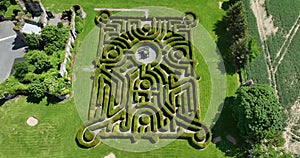 Hedge maze in city park. Labyrinth in the bushes. 5K Drone Footage