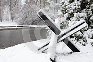 Hedgehog antitank defence in winter background. anti-tank protection in the form of large black metal hedgehogs photo