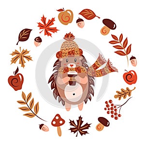 A hedgehog in a warm hat with a scarf and a mug with a hot drink. Autumn character. Animal, yellowing leaves of maple