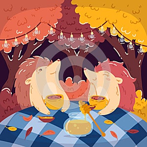 Hedgehogs tea party in the autumn forest, with a jar of honey. Glowing garlands hang on the trees. Children`s vector illustration