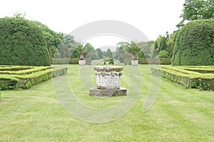 Hedgerow and fountain in castle park Lednice, Czec