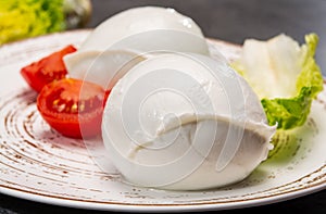 ÃÂ¡heese collection, balls on soft white mozzarella bufala cheese served with green cos lettuce and tomato photo
