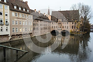 Heilig-Geist-Spital, historical hospital on Pegnitz river in old town of Nuremberg, Bavaria, Germany. November 2014