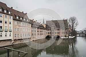 Heilig-Geist-Spital Hospice of the Holy Spirit in Old Town Nuremberg. View from the Museum Bridge on the on the River Pegnitz