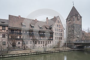 Heilig-Geist-Spital Hospice of the Holy Spirit in Old Town Nuremberg. View from the Museum Bridge on the on the River Pegnitz