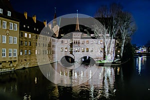 The Heilig-Geist-Spital at night in Nuremberg, Germany.