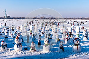 Heilongjiang Harbin China -  DEC, 29 2018 : Snowman doll near Songhua frozen river, People can walk down and arrange activities