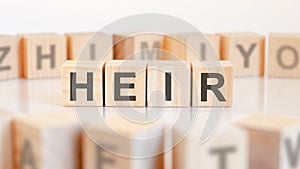 HEIR - word on wooden cubes on white background