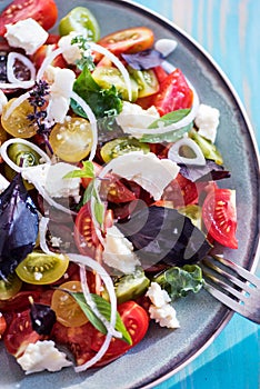 Heirloom tomatoes salad with cheese and basil