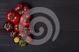 Heirloom tomatoes on wooden black board