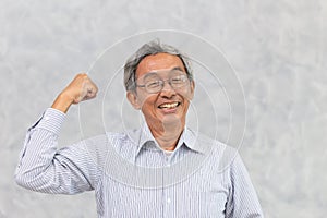 Helathy strong Chinese Asian elder happy smile with recovered from corona virus disease