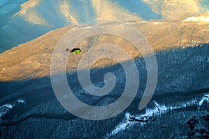 Heli ski service helicopter winter mountain aerial view in Krasnaya Polyana.