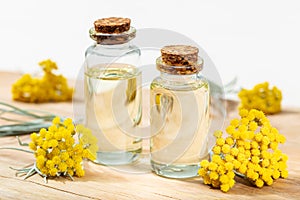 Helichrysum essential oil in glass bottle